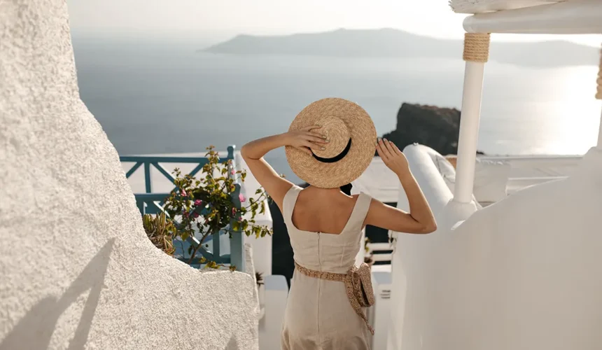lady-holds-straw-hat-woman-beige-dress-with-bag-goes-down-sea
